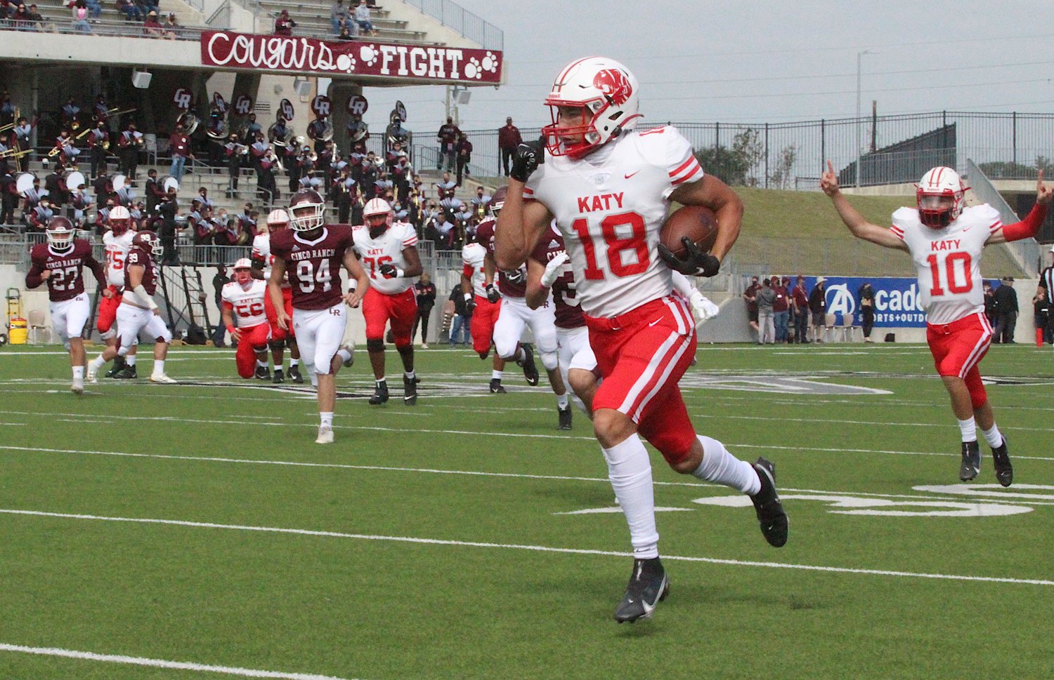 Katy High senior receiver Taylor Saulsberry is off to the races for a 46-yard first-half touchdown as quarterback Caleb Koger (10) celebrates behind him during the Tigers' win over Cinco Ranch on Oct. 24 at Legacy Stadium.
